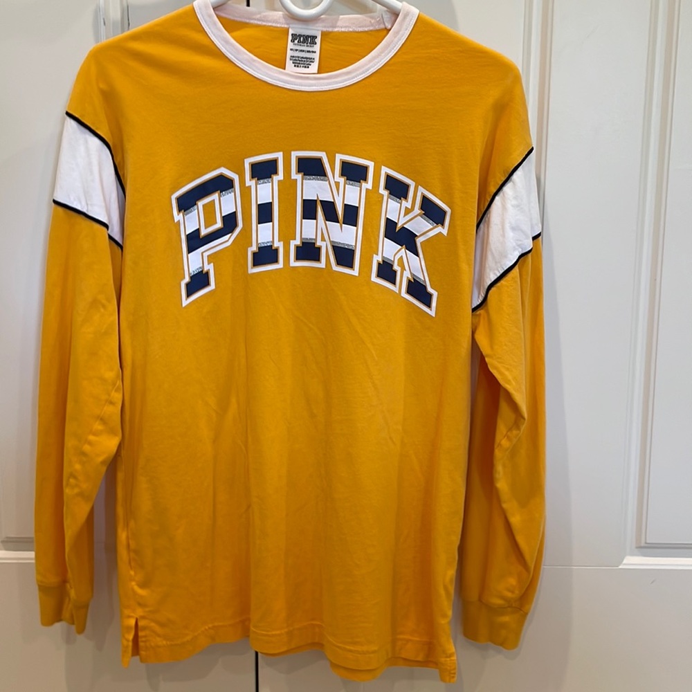 PINK yellow shirt with blue and white writing. Size: XS